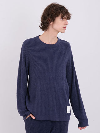 Model wearing men's hot smoothie long sleeves ribbed sweater in navy, showcasing cozy relaxed fit for casual styling.