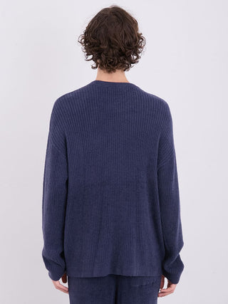 Back view of a men's navy ribbed long sleeves sweater, showcasing a relaxed fit and ultra-soft texture for comfortable wear.