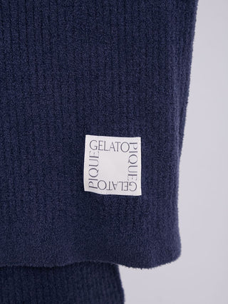 Close-up of navy Gelato Pique men's ribbed sweater detailing and logo patch.