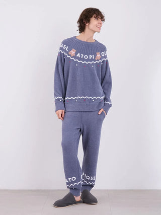 Man wearing a Men's Nordic Pullover Sweater with teddy bear jacquard design, showcasing cozy and stylish Nordic-inspired fashion.