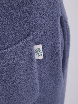 Close-up of Gelato Pique label on soft fuzzy fabric from Mens Nordic Lounge Set, showcasing texture and design detail.