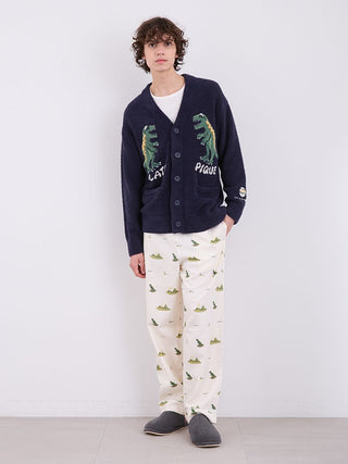 Model wearing MEN'S Powder Dinosaur Jacquard Knit Cardigan with dinosaur design, paired with printed pants and slippers.