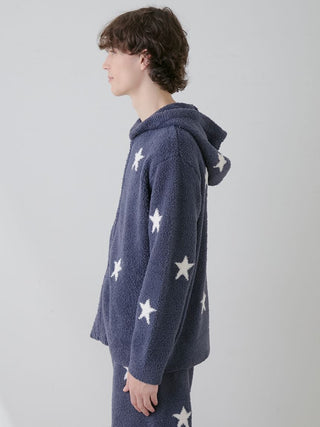 Side view of a person wearing a Powder Star Jacquard Zip Up Hoodie with star pattern, showcasing cozy and stylish loungewear design.
