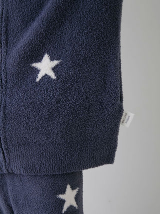 Close-up of Powder Star Jacquard Zip Up Hoodie with star pattern and soft powder knit fabric, featuring cozy dark blue texture.