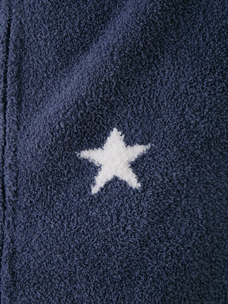 Close-up of Powder Star Jacquard Zip Up Hoodie fabric, featuring a white star pattern on soft navy material for cozy comfort.