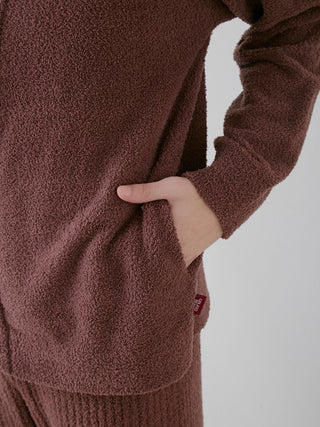 Close-up of a men's baby moco chocolate button-up cardigan highlighting soft texture and pocket detail, ideal for winter comfort.