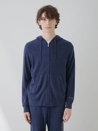 Model wearing Gelato Pique USA Temperature-Control Smoothie Zip-Up Hoodie in navy, showcasing cozy and breathable fabric design.
