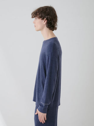 Side view of a man wearing a navy Men's Thermal Smoothie Pullover Sweater, showcasing its sleek and cozy design by Gelato Pique USA.