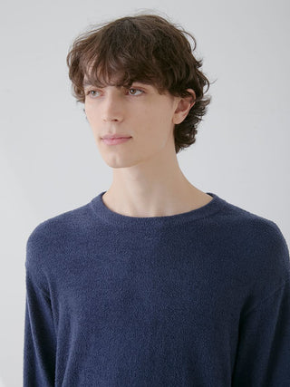 Model wearing Men's Thermal Smoothie Pullover Sweater by Gelato Pique USA, showcasing its sleek and cozy design in navy blue.