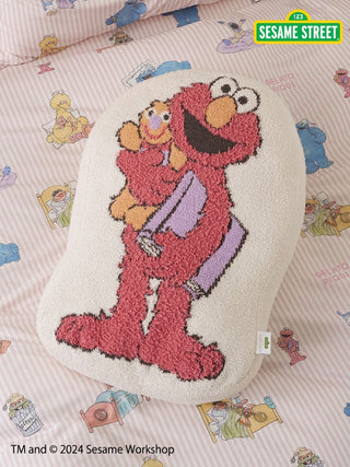 Elmo cushion with Baby Moco fabric featuring an adorable smile, perfect for children; part of Sesame Street collaboration.