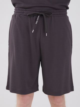 Unisex Big Logo Lounge Shorts in dark color, featuring logo waist strap and knee-length design for stylish comfort.