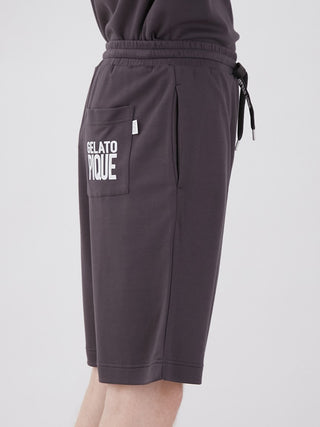 Side view of unisex Gelato Pique Big Logo Lounge Shorts with waist logo strap and back pocket, showcasing comfort and style.