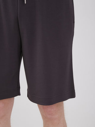 Unisex Big Logo Lounge Shorts made from high-quality yarn, featuring knee-length design and relaxed fit in black for ultimate comfort.