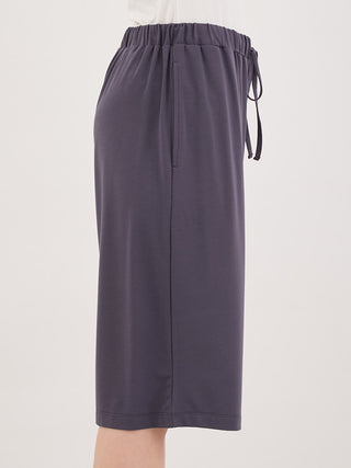 Side view of Cool Polar Bear Unisex Comfy Lounge Shorts in dark gray, featuring elastic waistband and pockets for relaxed summer style.