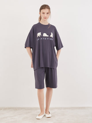 Model wearing Gelato Pique Cool Polar Bear Unisex Comfy Lounge Shorts with oversize shirt, showcasing stylish and comfortable loungewear.