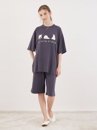 Model wearing Cool Polar Bear Unisex Comfy Lounge Shorts by Gelato Pique in dark color, perfect for summer relaxation and style.