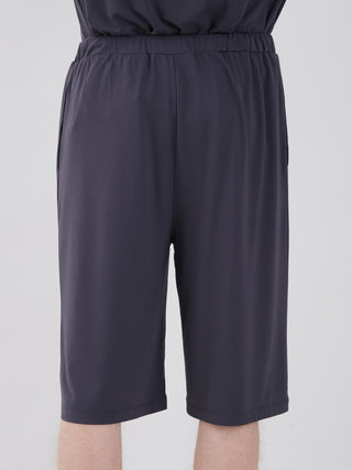 Back view of black unisex comfy lounge shorts with elastic waistband, ideal for summer relaxation and style.