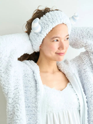 Woman wearing PIQUE MONSTER headband with fluffy texture, perfect for Halloween. Part of gelato pique's plushie monster collection.