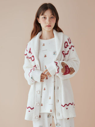 Model wearing unisex Nordic shawl collar cardigan with teddy bear detail, crafted from Gelato Pique's soft plush fabric.