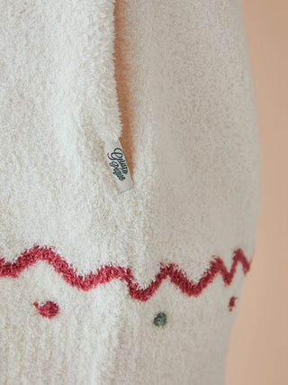 Close-up of Gelato Pique unisex Nordic shawl collar cardigan showing plush fabric and zigzag trim detail.