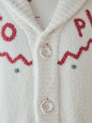 Close-up of unisex Nordic shawl collar cardigan with zigzag trims and Gelato Pique buttons, showing soft plush fabric texture.