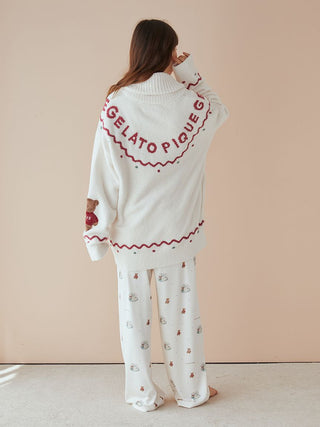 Model wearing a cozy white Nordic shawl collar cardigan with whimsical teddy bear detailing by Gelato Pique.