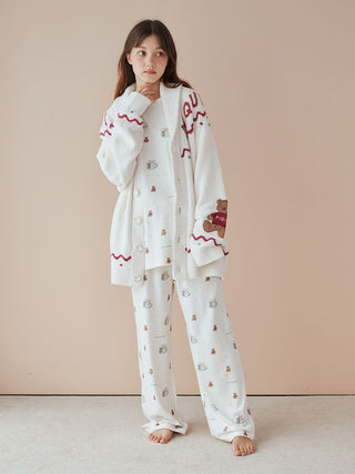 Model wearing Unisex Nordic Shawl Collar Cardigan with teddy bear detailing, featuring Gelato Pique's plush fabric and festive pattern.