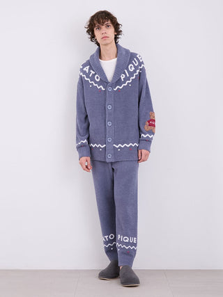 Model wearing a unisex Nordic shawl collar cardigan with zigzag trims and teddy bear detail in plush fabric by Gelato Pique.