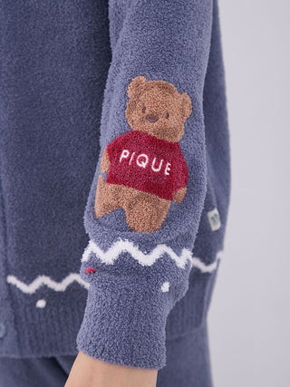 Close-up of Nordic shawl collar cardigan sleeve with teddy bear design and zigzag trims, showcasing Gelato Pique's plush fabric.