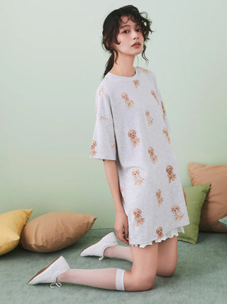 Woman wearing Toy Poodle Motif Oversize Lounge T-shirt with premium loungewear and sleepwear, Gelato Pique USA, in cozy room.