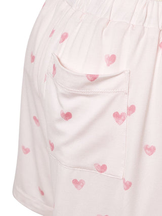 Close-up of Gelato Pique lounge shorts with pink heart motifs, showcasing soft, breathable fabric for ultimate comfort and style.