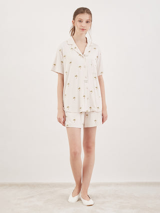 Woman wearing fruit motif loungewear sleep shirt set, summertime chic rayon for cool comfort, front view.