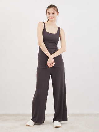 Woman wearing Gelato Pique USA Water Absorption Tank Top in black, demonstrating style and comfort with premium teleco fabric.