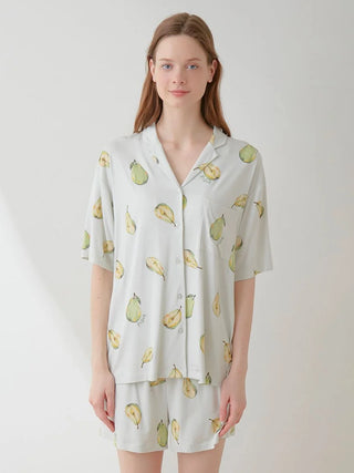 Woman wearing Fruit Pattern Pajama Sleep Shirt with all-over pear motif; soft green and white colors.