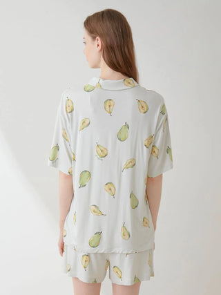 Woman wearing Gelato Pique Fruit Pattern Pajama Sleep Shirt with watercolor pear design, demonstrating back view for sleepwear collection.