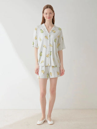 Woman wearing Fruit Pattern Pajama Sleep Shirt with pear design in soft watercolor style, showcasing comfortable sleepwear fashion.