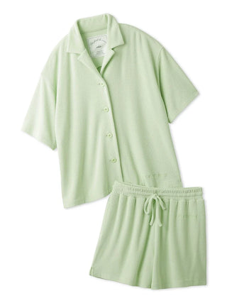 Light green terry cloth button-down loungewear set with short-sleeved shirt and matching shorts, offering luxurious comfort.