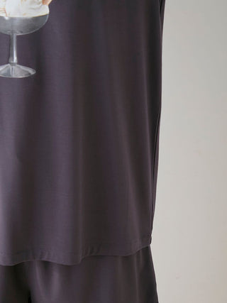 Close-up of the COOL Rayon Dessert Logo Relaxed Fit T-shirt in black, showcasing its smooth texture and relaxed design.