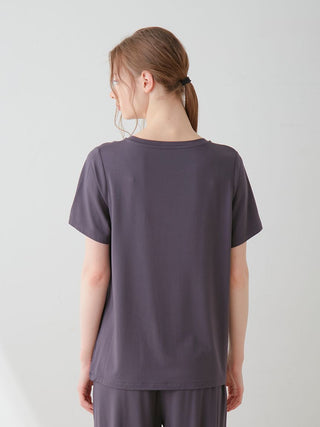 Back view of a COOL Rayon Logo Relaxed Fit T-shirt in soothing pink, showcasing luxurious comfort and smooth rayon fabric.
