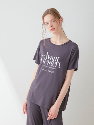 Woman wearing a COOL Rayon Logo Relaxed Fit T-shirt in gray, showcasing comfort and style.