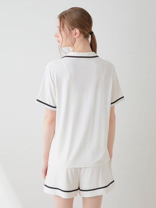 Back view of woman wearing COOL Rayon Logo Button-Up Sleep Shirt, showcasing soft and breathable rayon fabric.