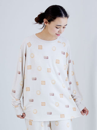 Woman wearing Biscuit Pattern Waffle Long Sleeve T-shirt with Gelato Pique branding, showcasing cozy waffle-knit texture for loungewear.