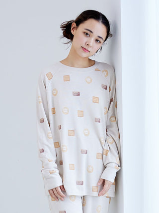 Woman wearing a Biscuit Pattern Waffle Long Sleeve T-shirt with Gelato Pique branding, featuring a cozy waffle-knit texture.