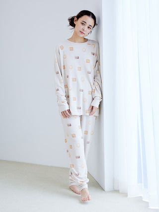 Woman wearing Biscuit Pattern Waffle Long Sleeve T-shirt with playful design, perfect for loungewear, featuring Gelato Pique branding.
