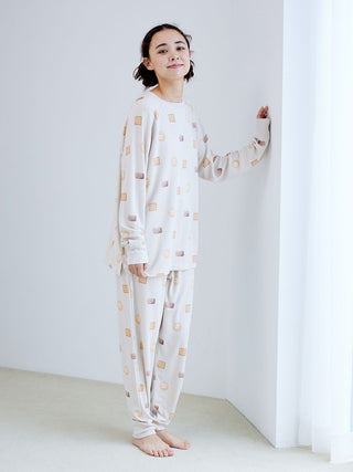 Woman wearing Biscuit Pattern Waffle Long Sleeve T-shirt with matching pants, showcasing cozy loungewear by Gelato Pique.