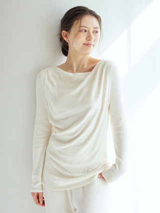 Woman wearing Snow Long Sleeve Shirt Loungewear with draped neckline and relaxed fit, showcasing cozy comfort and effortless elegance.