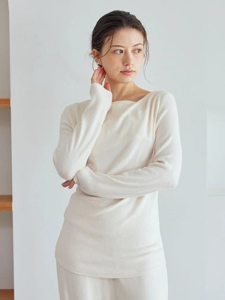 Woman wearing Snow Long Sleeve Shirt Loungewear, showing elegant draped neckline and cozy, relaxed fit in soft, cream fabric.