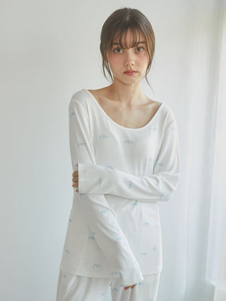 Woman wearing Motif 3-Pattern Long Sleeve T-Shirt with bow motif, showcasing soft and elegant lounge wear for casual comfort.