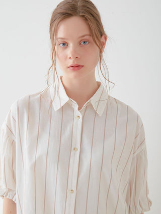 Woman wearing Resort Woven Striped Shirt Midi Dress in neutral tones, featuring a classic vertical stripe pattern.