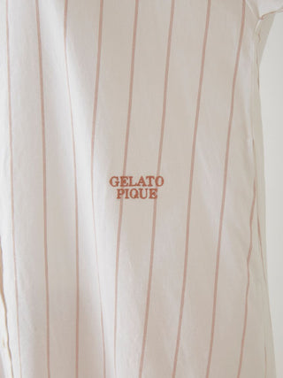 Close-up of Gelato Pique woven striped shirt dress with logo embroidery, showcasing vertical neutral stripes for elegant style.